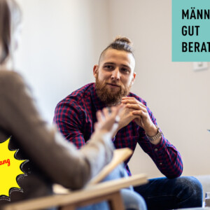 Female psychologist talking to young man during session.