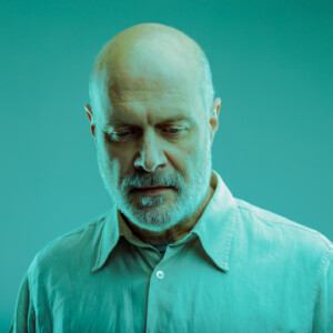 Thoughtful or depressed senior man looking down Thoughtful or depressed senior man looking down with a serious contemplative expression in a head and shoulders portrait